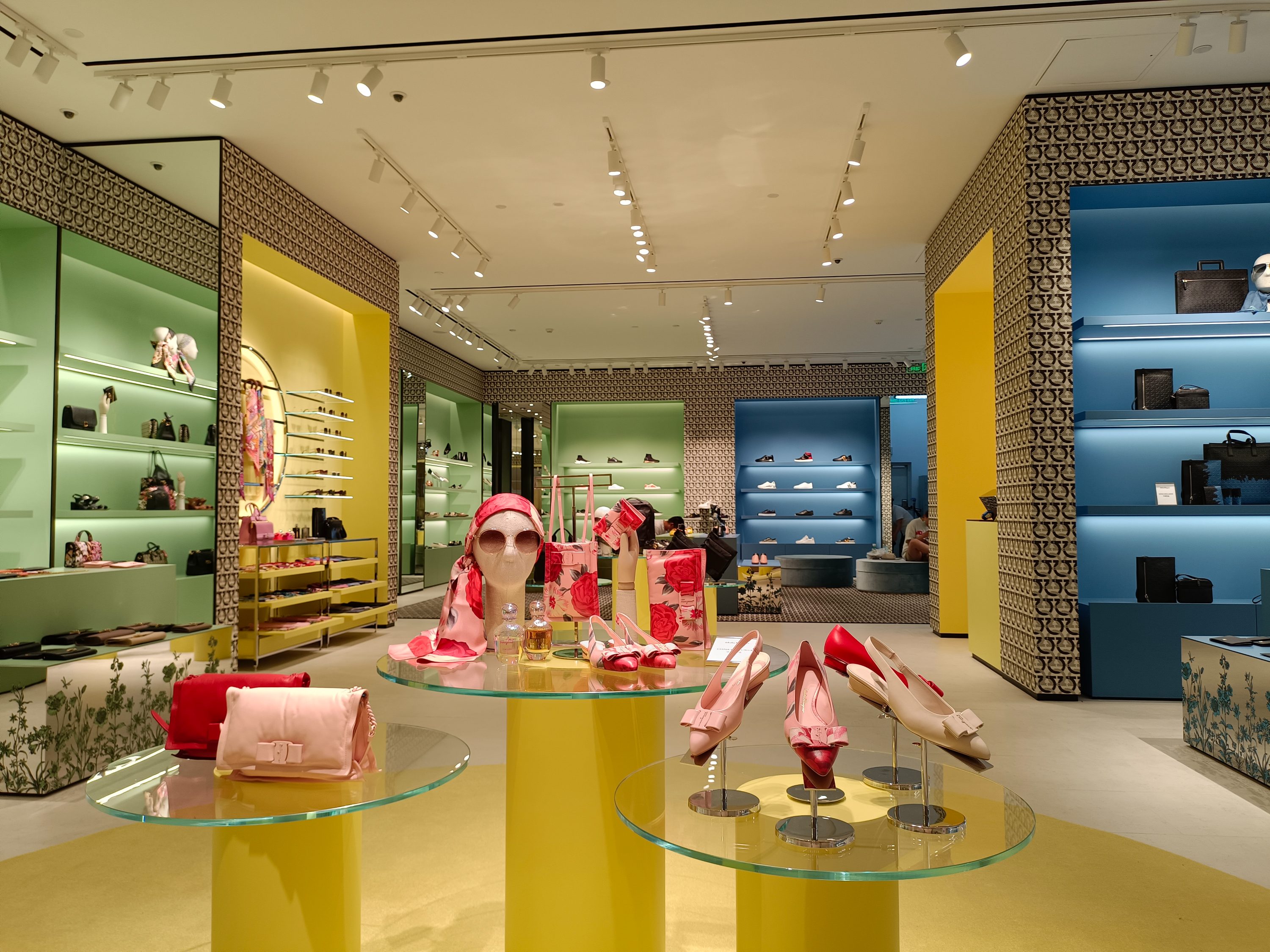 Luxury retail store illuminated with architectural track lighting for premium product displays